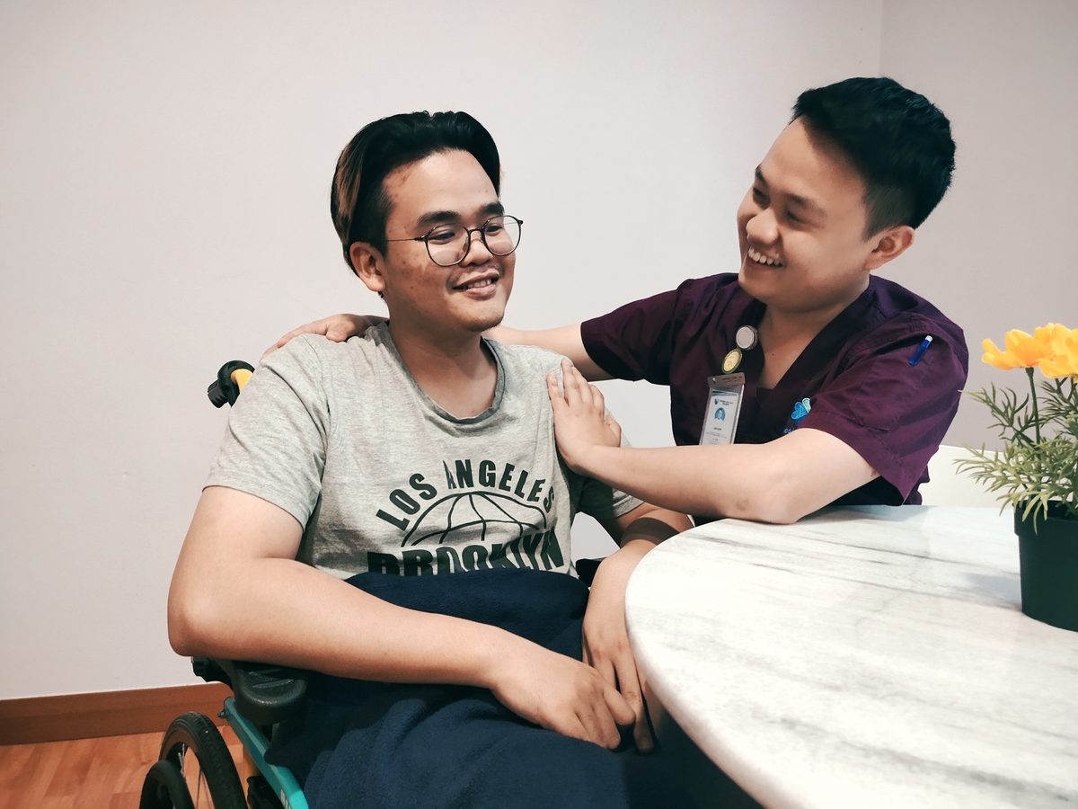 A Genesis caregiver providing hands-on care